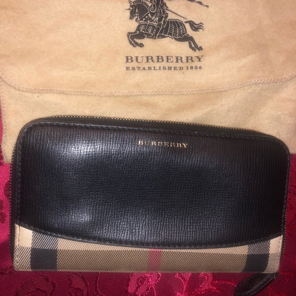 Burberry wallet. Lightly used. Half leather half canvas.